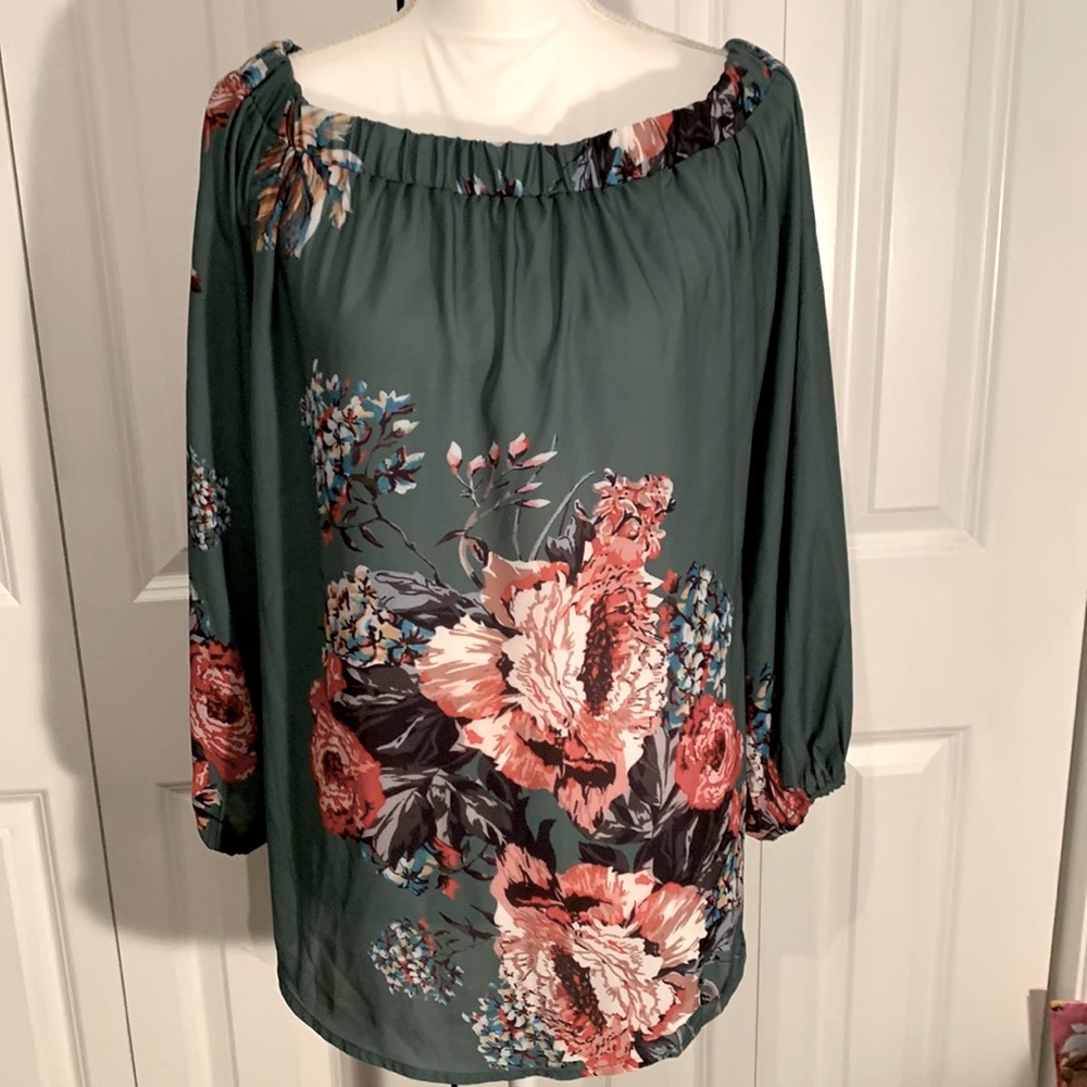 NWOT…. Off the shoulder top. Beautiful colors size XL